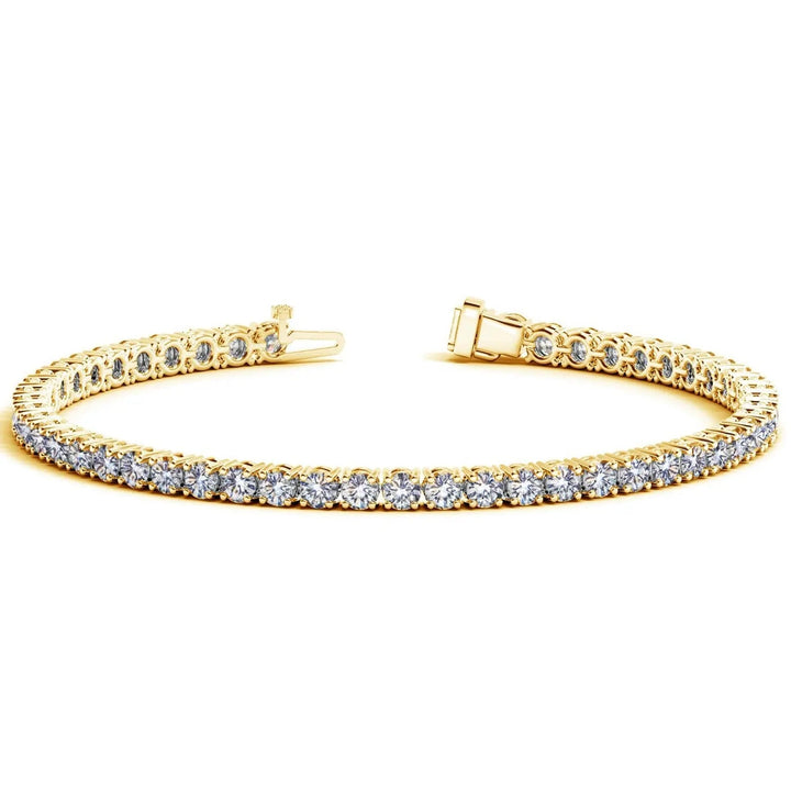 Open box clasp of a lab-grown diamond tennis bracelet in solid 14K yellow gold, showing the spring tongue on one end and the box housing with its safety catch on the other