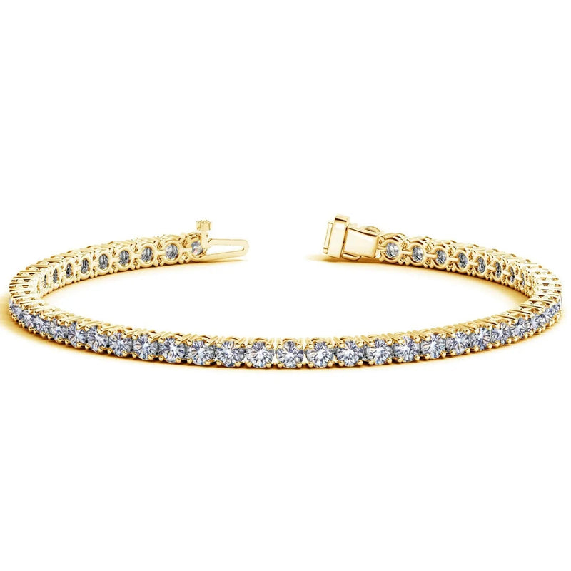 Open box clasp of a lab-grown diamond tennis bracelet in solid 14K yellow gold, showing the spring tongue on one end and the box housing with its safety catch on the other
