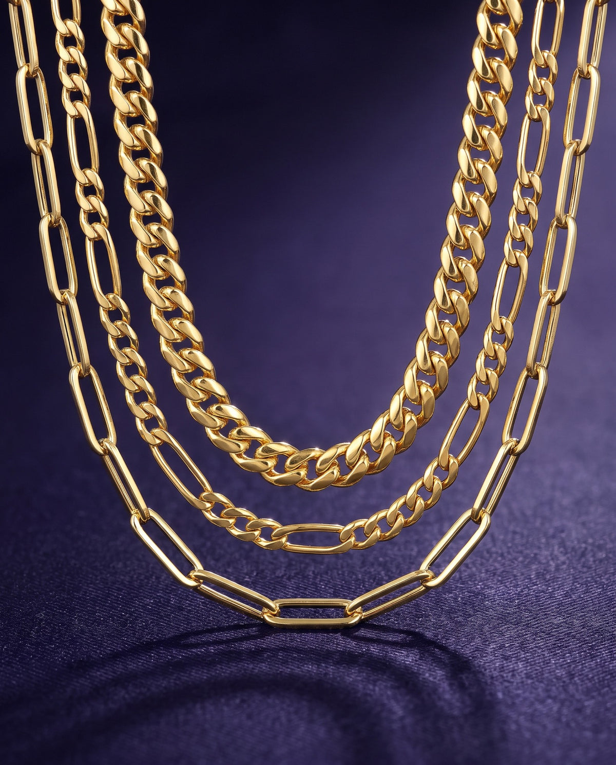 Cuban, Figaro and paperclip chain necklaces in 14K yellow gold