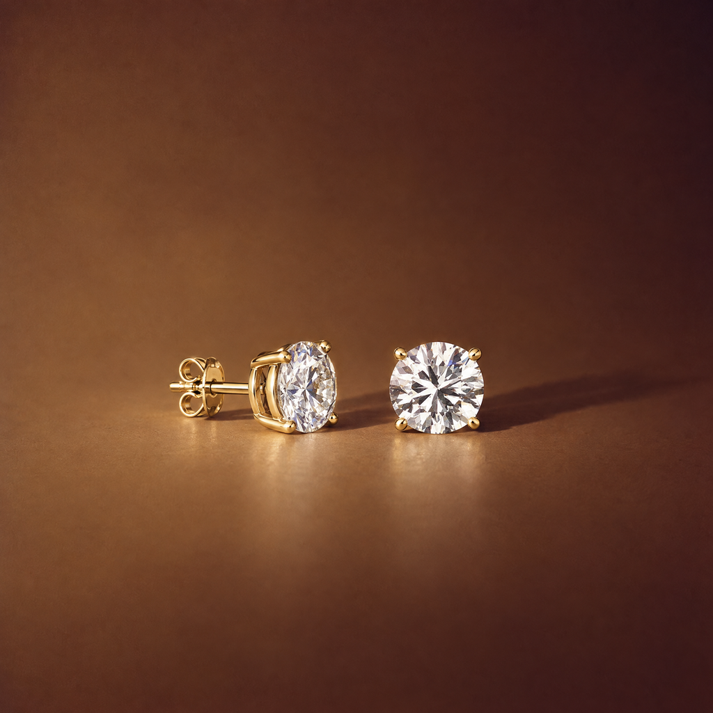 Pair of 4 carat round lab-grown diamond stud earrings in 14K yellow gold, one shown side-on with its four-prong basket, post and push back, brown background, AI-generated image — DEEVE