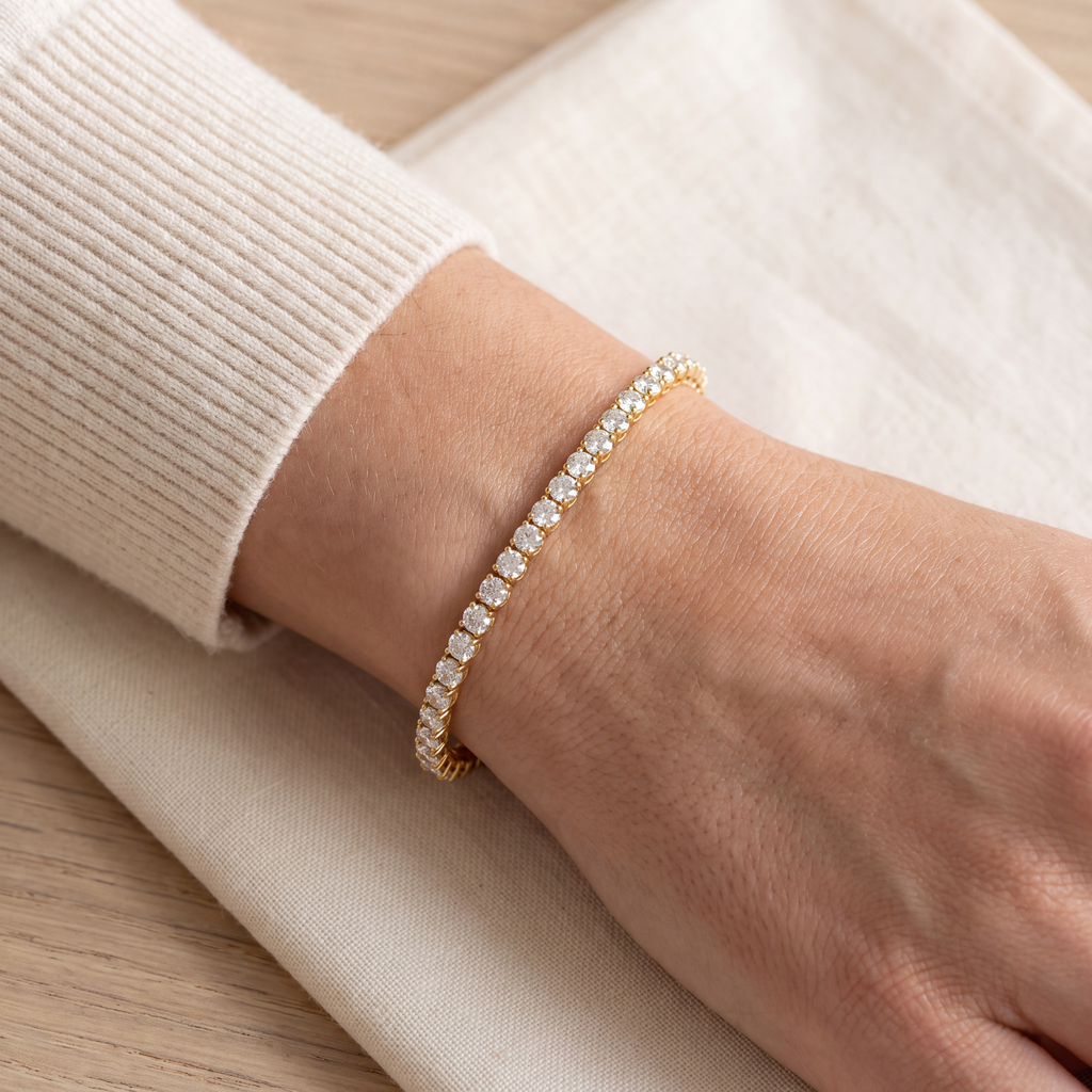 Close-up of a 7 carat lab-grown diamond tennis bracelet in 14K yellow gold worn on the wrist, AI-generated image — DEEVE
