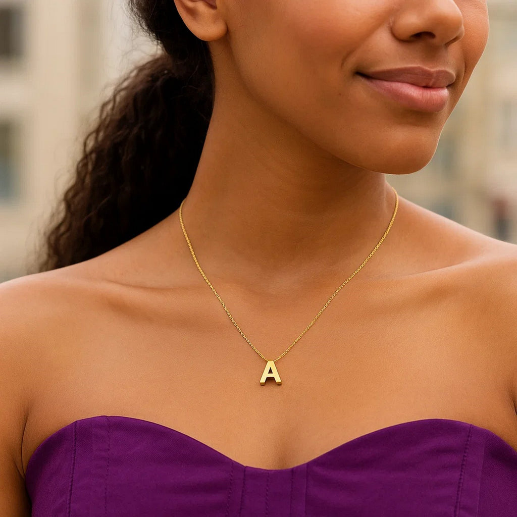 Block letter A initial necklace in 14K yellow gold worn, second view