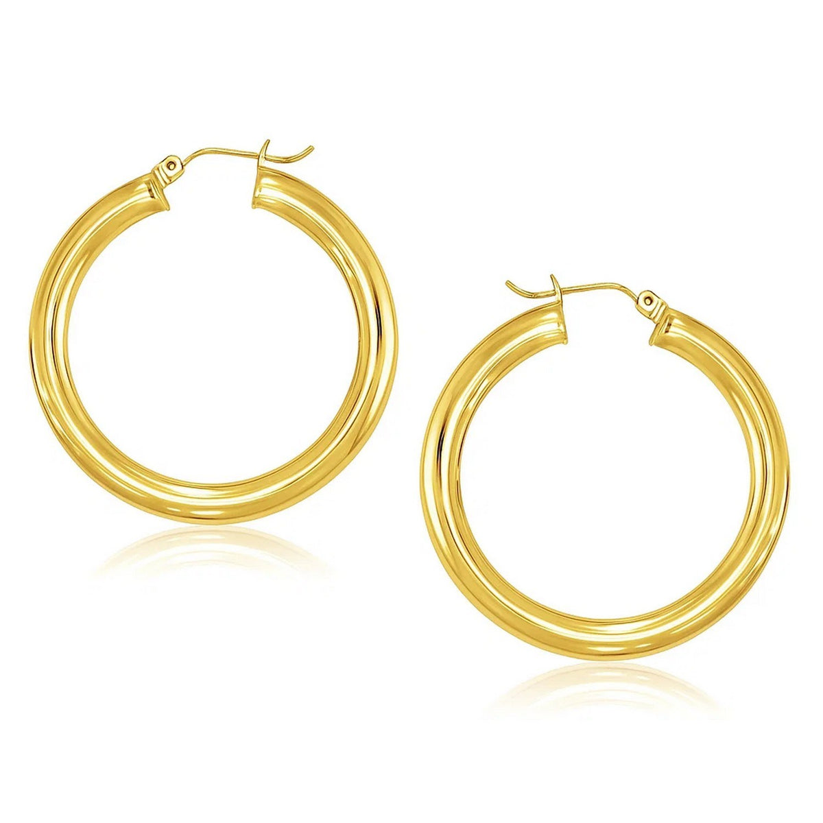 Polished 40mm hoop earrings in 14K yellow gold, 5mm wide, angled view of the pair