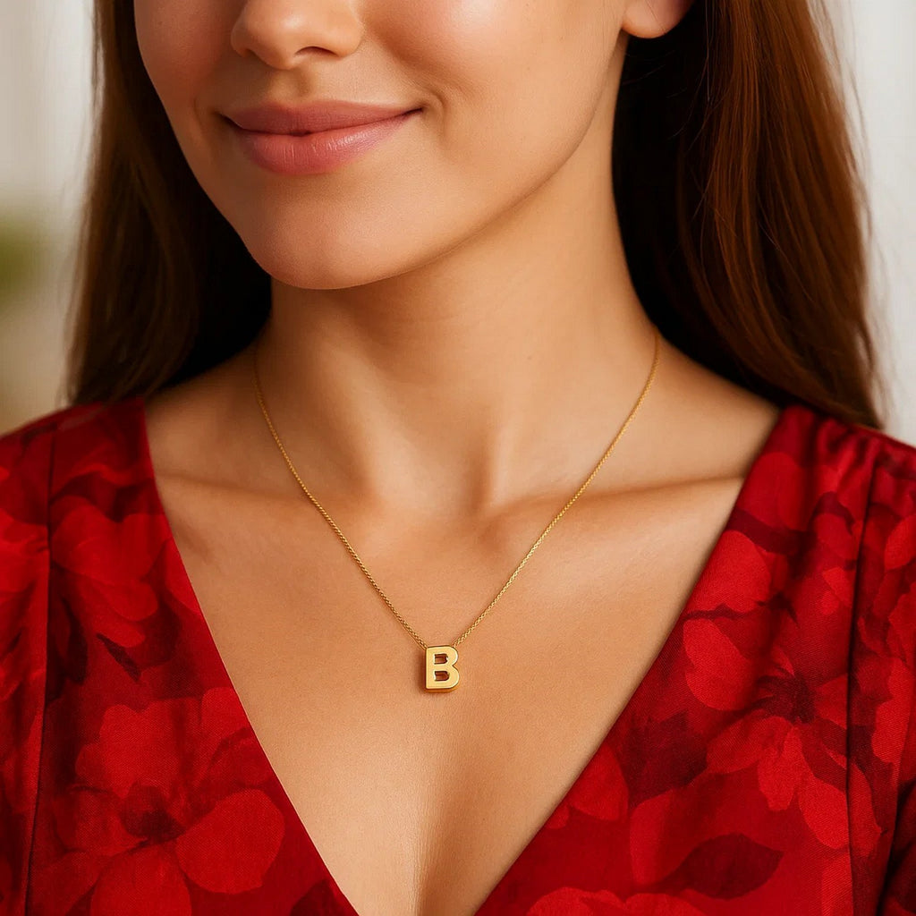 Block letter B initial necklace in 14K yellow gold worn, second view