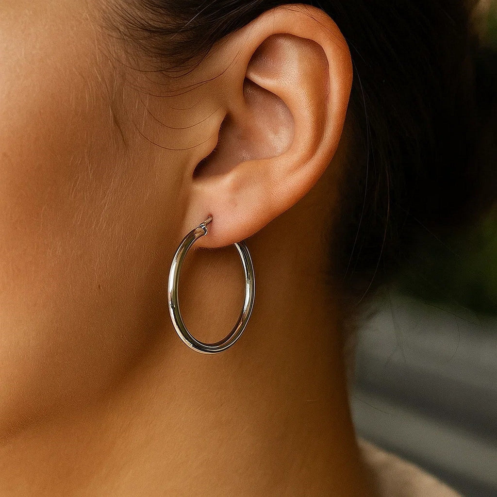 Close-up of a 30mm 14K white gold hoop on the ear