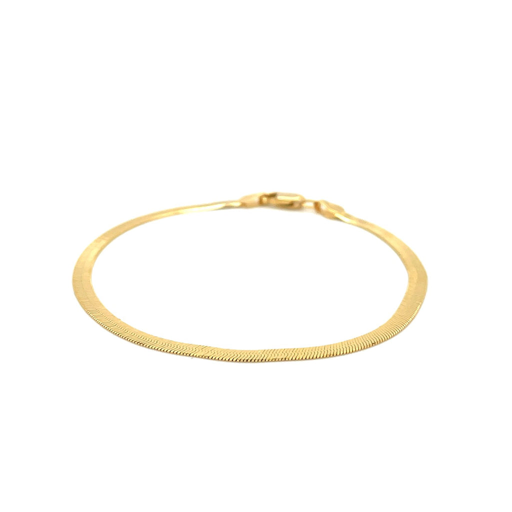 Super Flex herringbone bracelet in 14K yellow gold, 2.80mm, laid flat in a circle