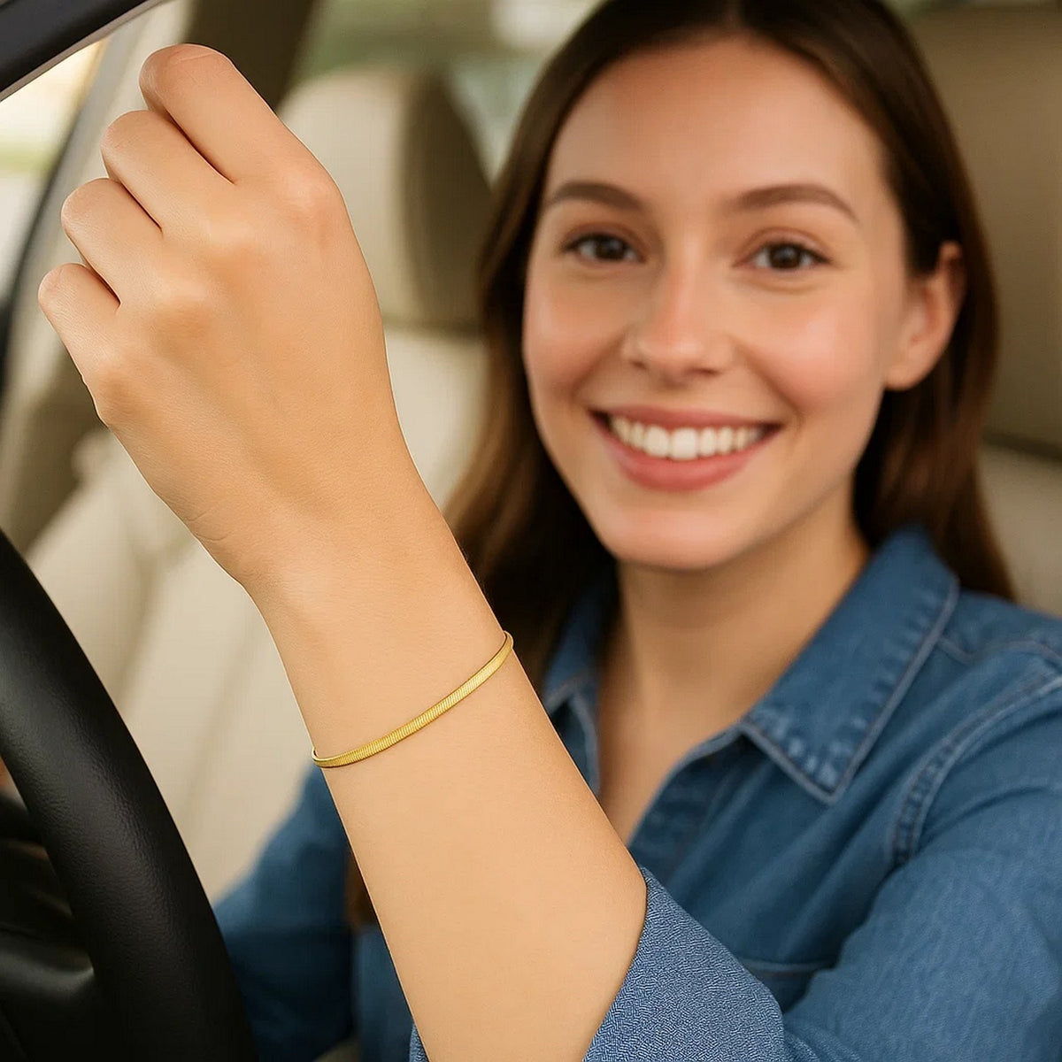 Herringbone bracelet in 14K yellow gold worn while driving