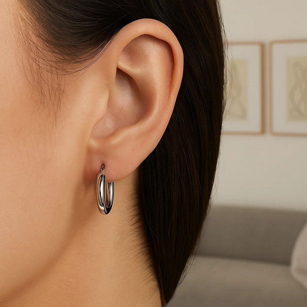 15mm 14K white gold hoop on the ear, side view