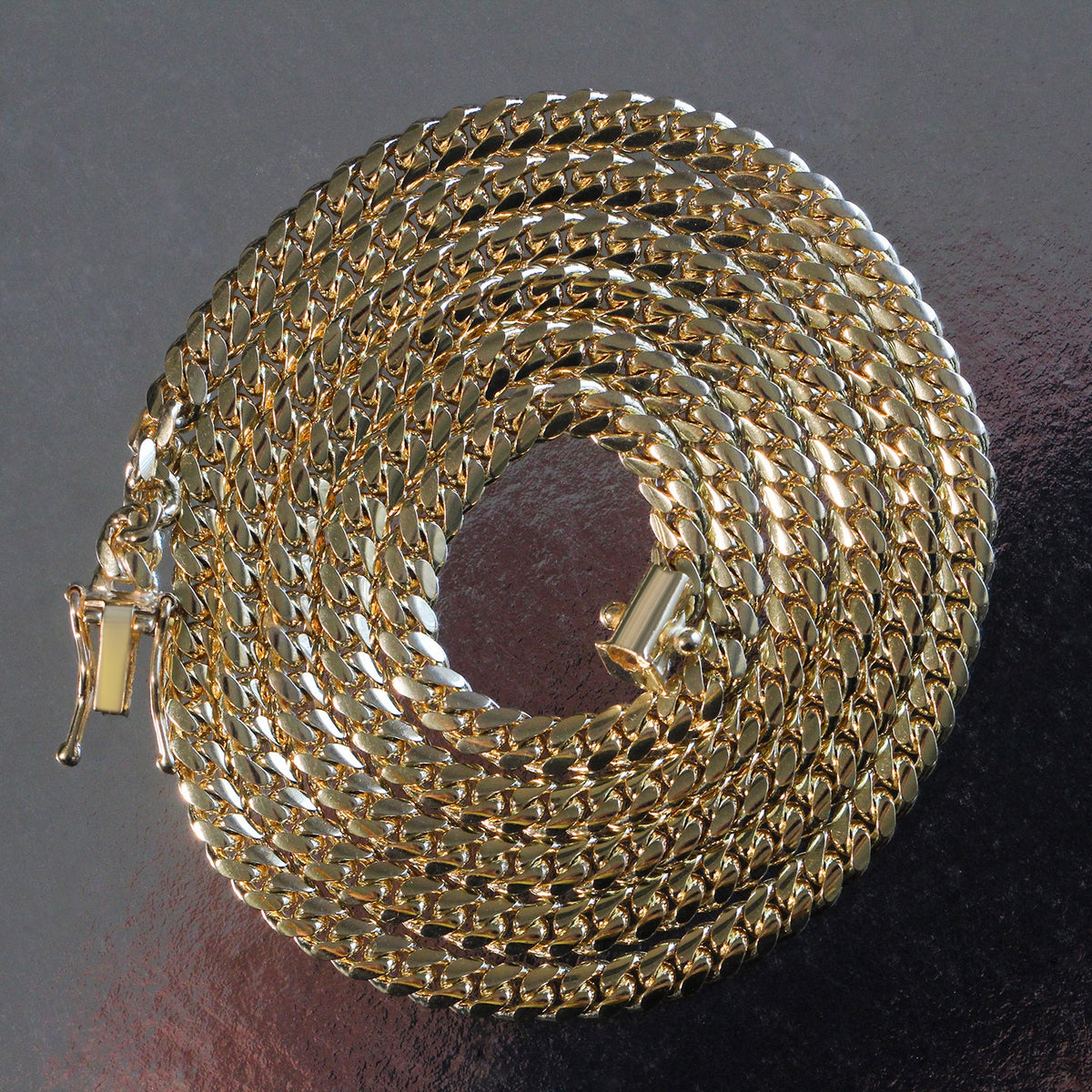 14K yellow gold solid Miami Cuban chain, 4.0mm, coiled to show the links