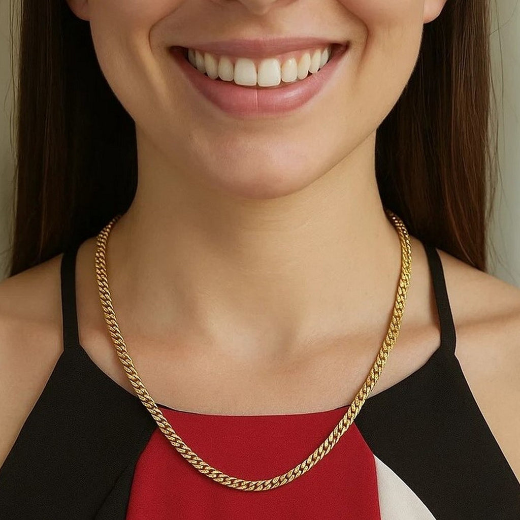 Solid Miami Cuban chain in 14K yellow gold, 4.0mm, worn at the collarbone