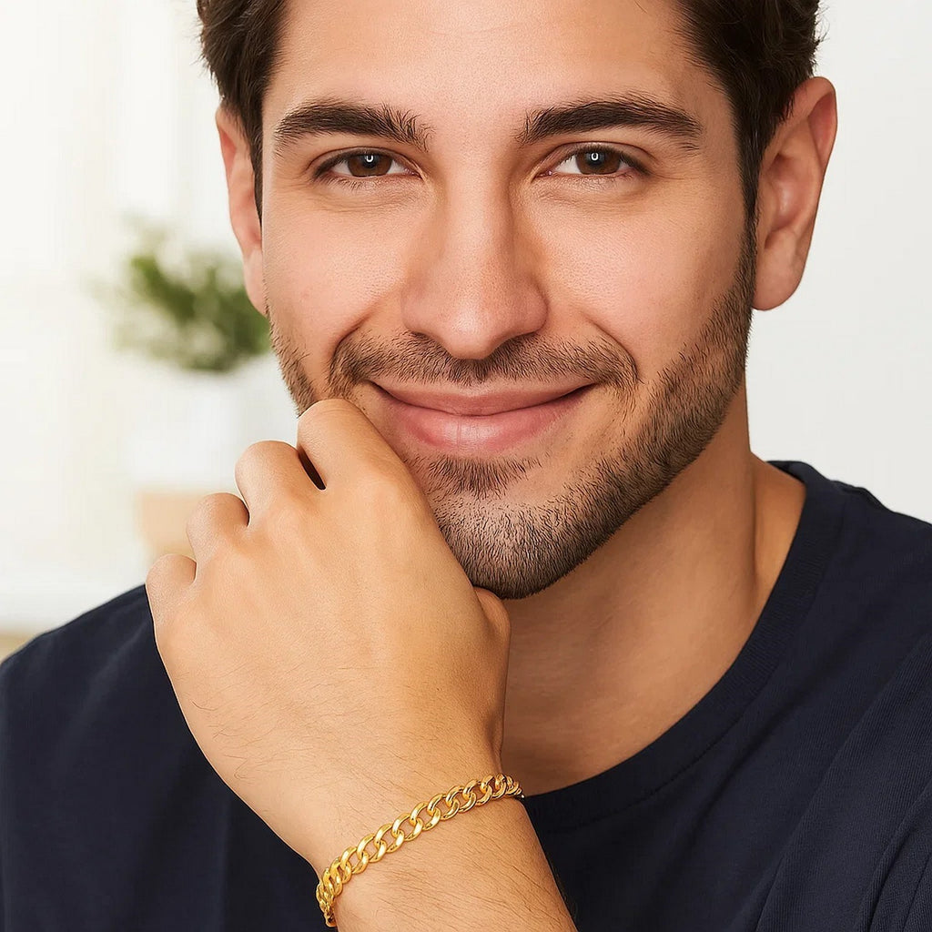 Man in a navy tee wearing the 14K yellow gold curb bracelet