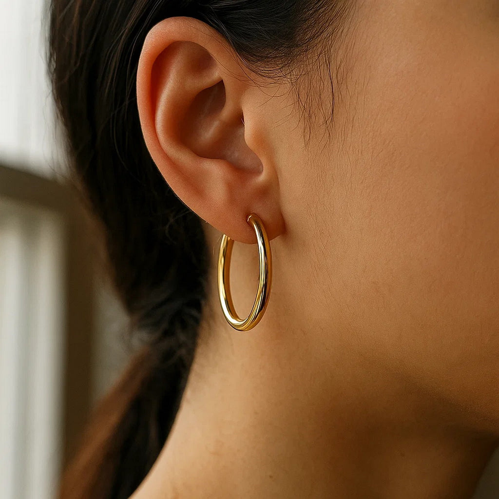 30mm 14K yellow gold hoop on the ear, side view