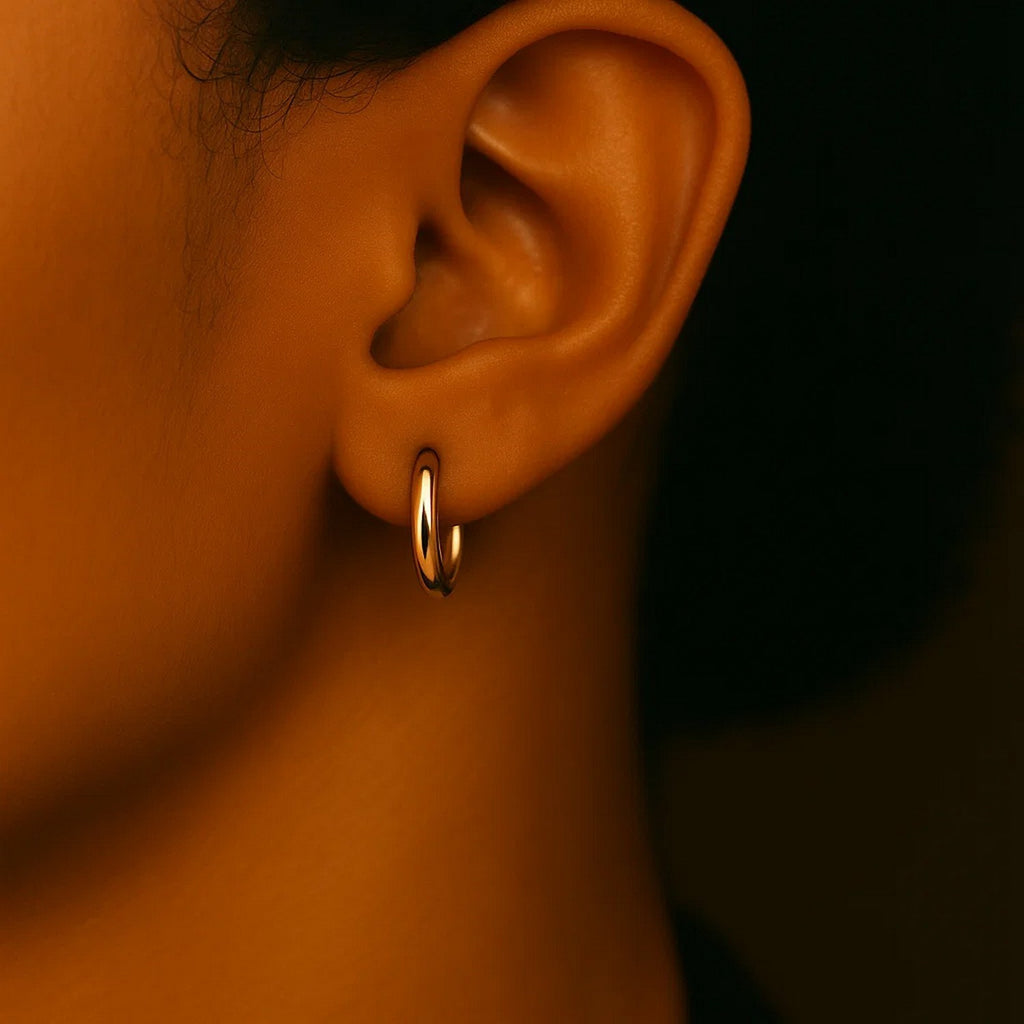 Close-up of a 15mm 14K yellow gold hoop on the ear
