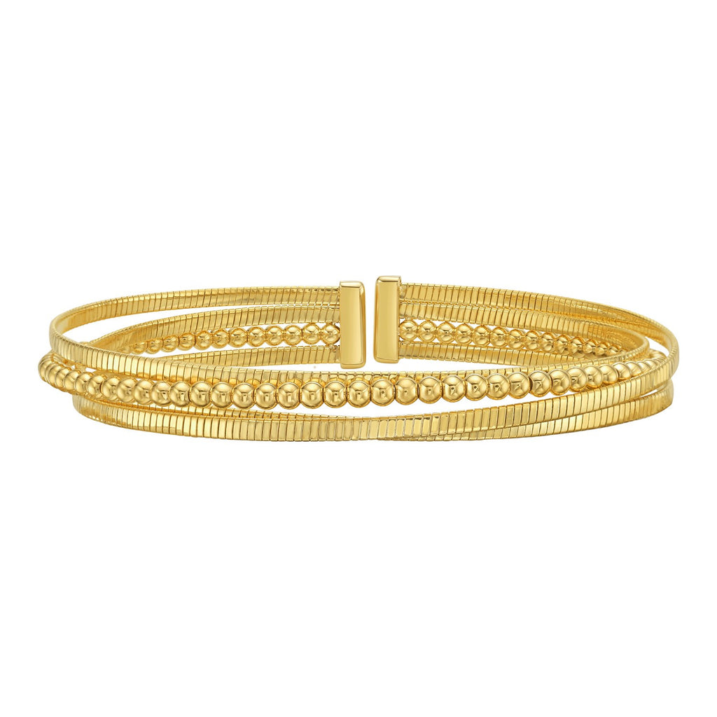 Layered open cuff in 14K yellow gold with ribbed omega strands and a polished bead strand