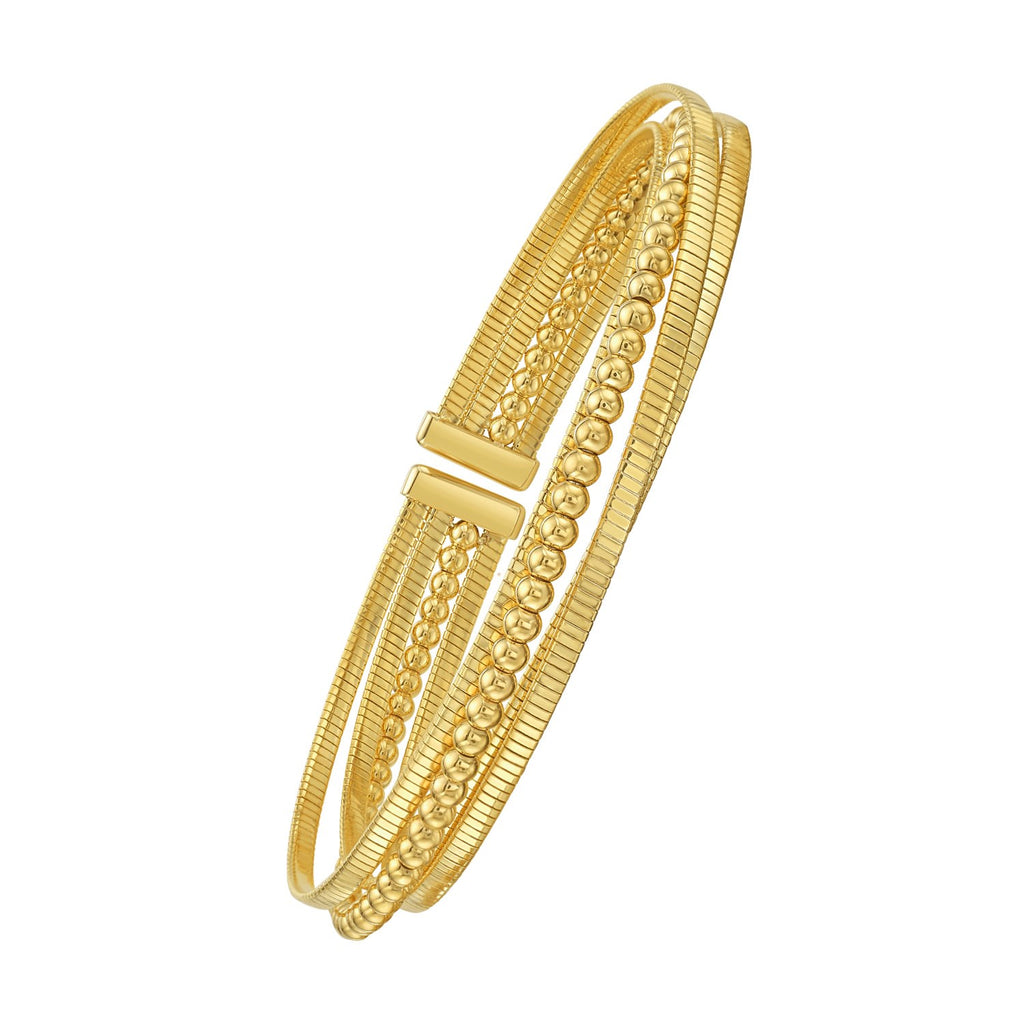 14K yellow gold layered omega and bead cuff seen at an angle, showing the open front