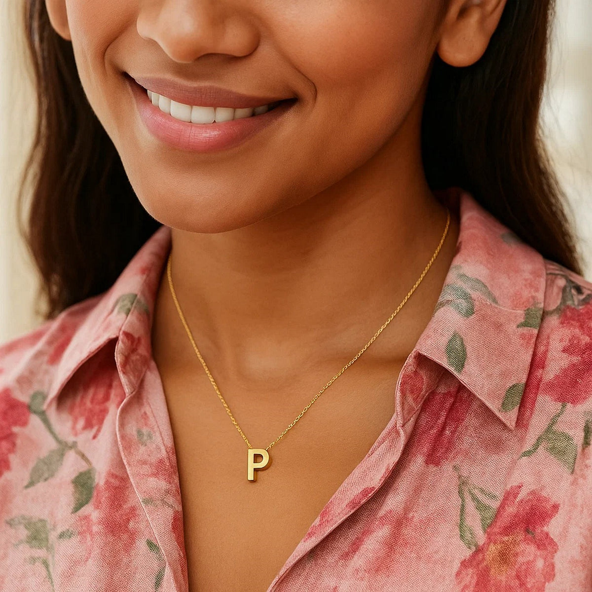 Block letter P initial necklace in 14K yellow gold worn at the neckline