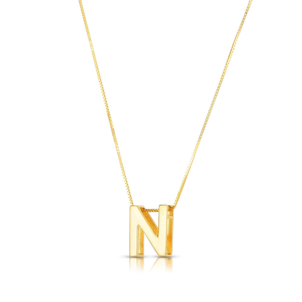 Block letter N in polished 14K yellow gold, angled to show its depth, on a box chain