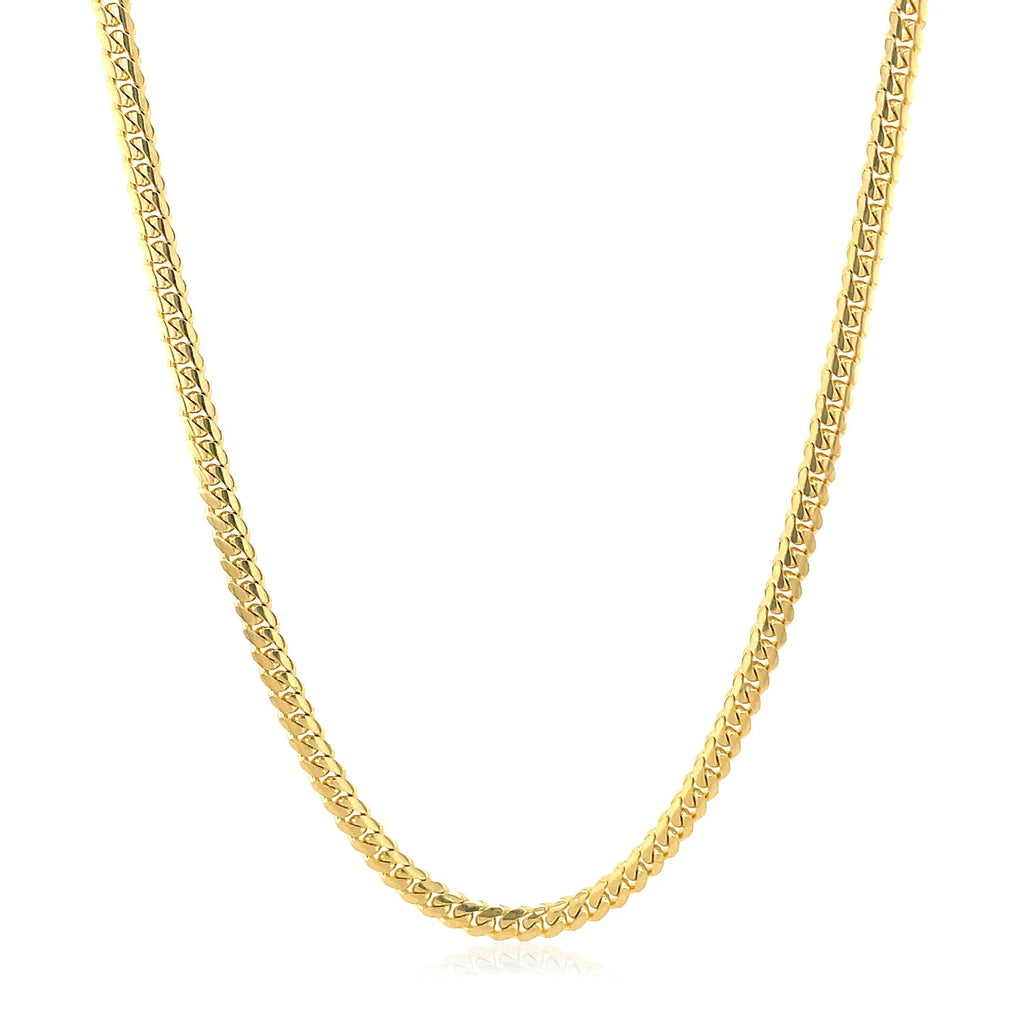 Solid Miami Cuban chain in 14K yellow gold, 2.60mm, hanging in a curve