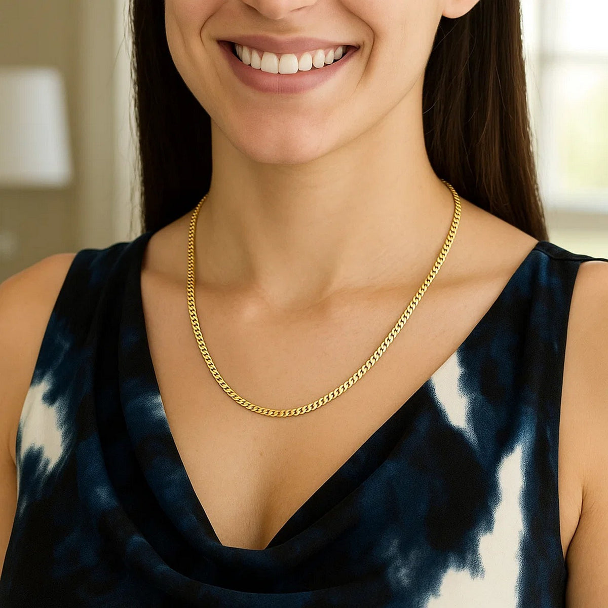 2.60mm solid Miami Cuban chain in 14K yellow gold worn at the collarbone