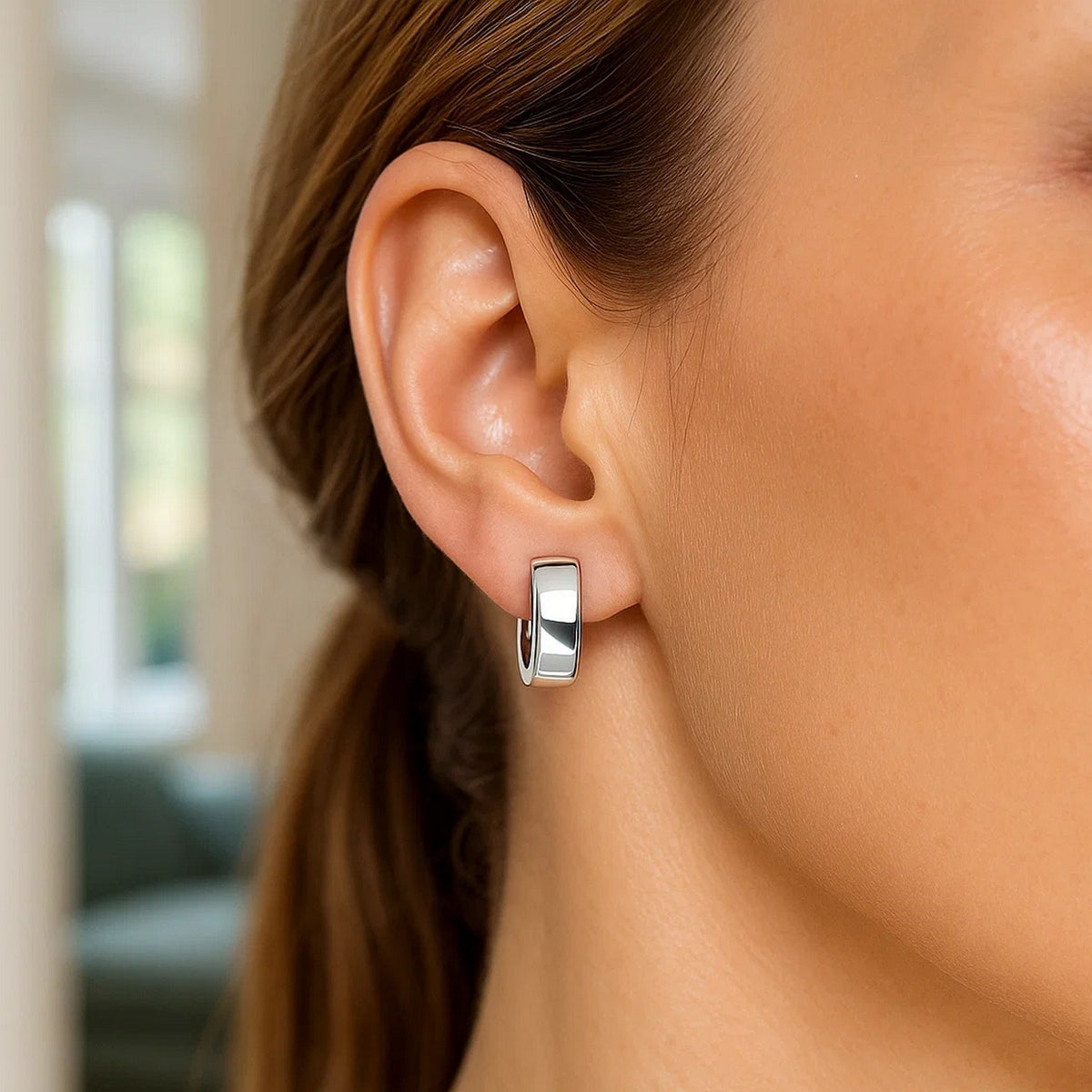 Snuggable 14K white gold huggie on the ear