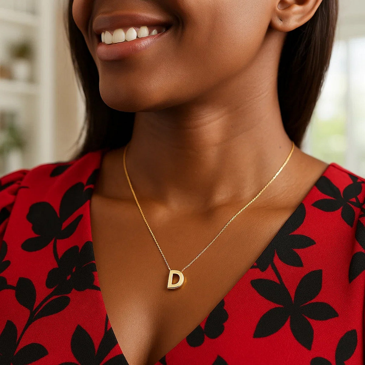 Block letter D initial necklace in 14K yellow gold worn, second view