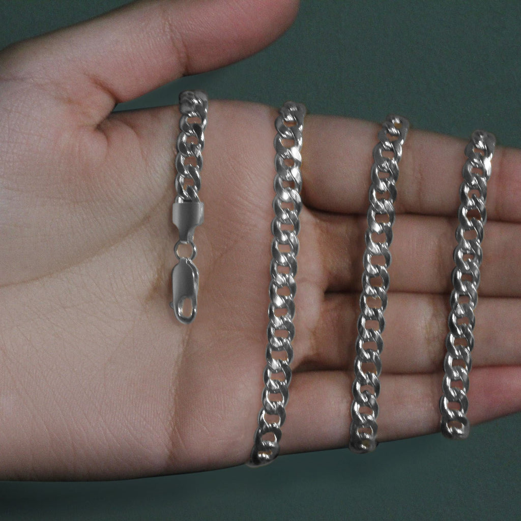 5.50mm Miami Cuban chain in 14K white gold held across an open palm