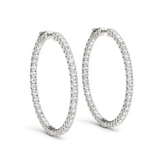 Front view of 14K white gold diamond hoop earrings with shared prong setting