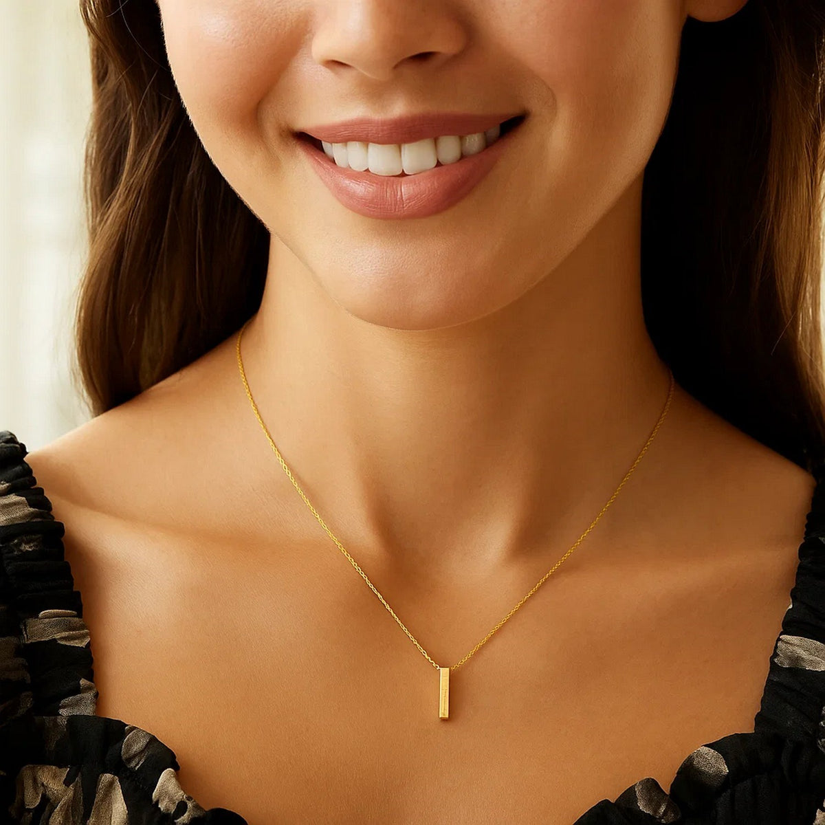 Block letter I initial necklace in 14K yellow gold worn at the neckline