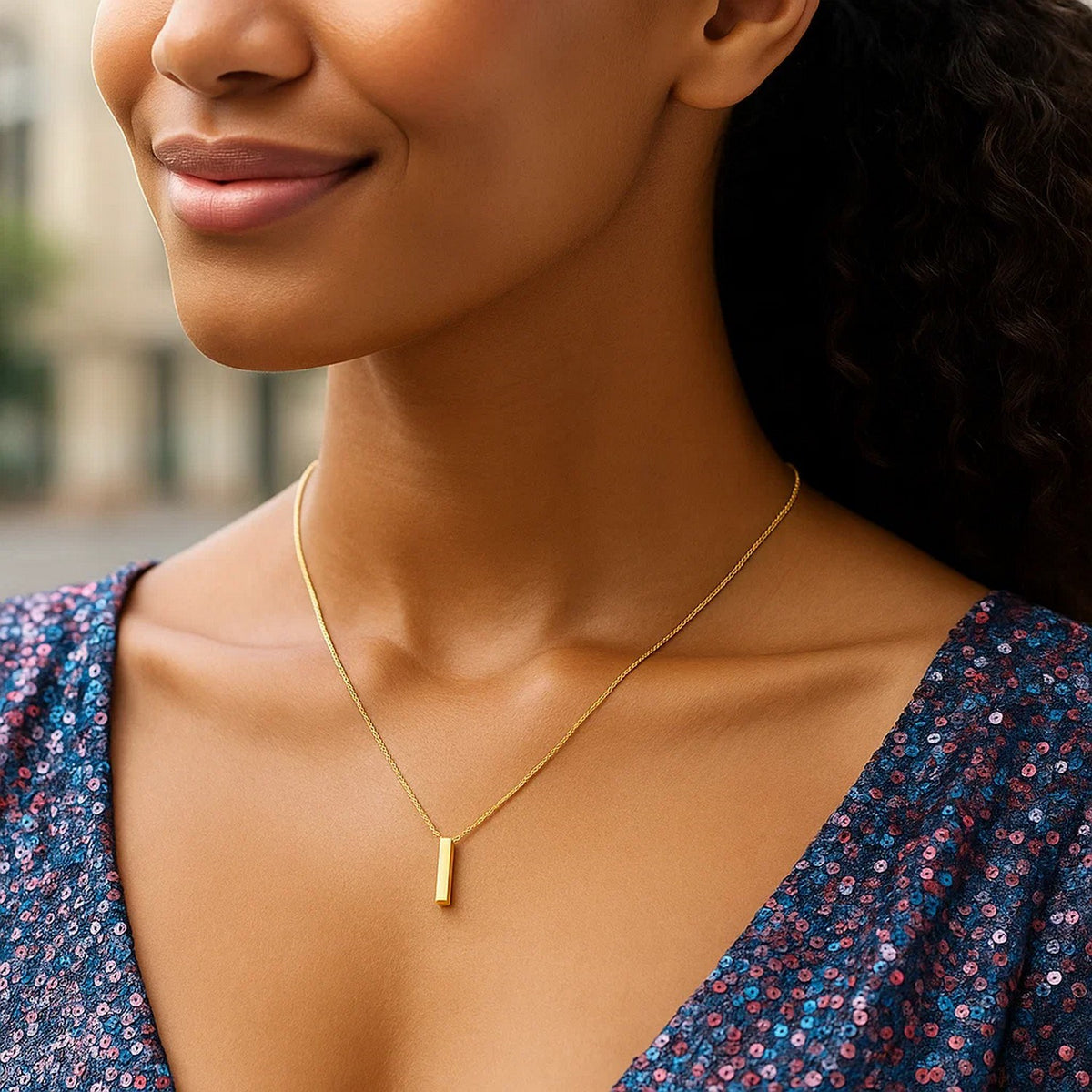 Block letter I initial necklace in 14K yellow gold worn, second view