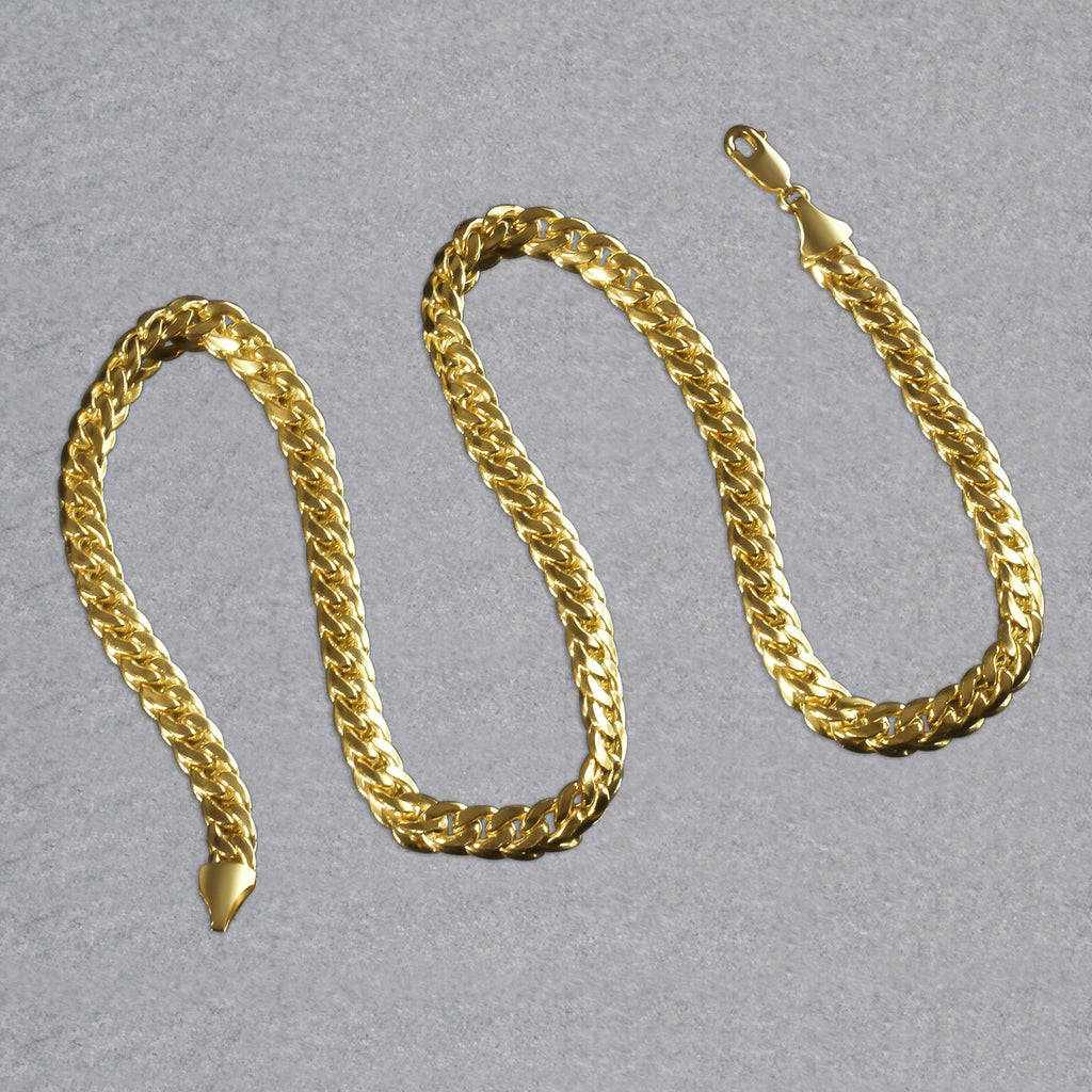 7.00mm Miami Cuban chain in 14K yellow gold laid out in an S-curve
