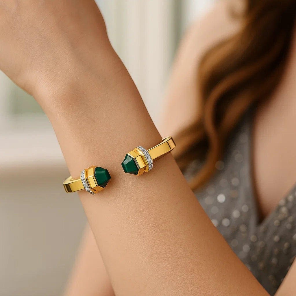 Malachite open cuff in 14K yellow gold worn on the wrist