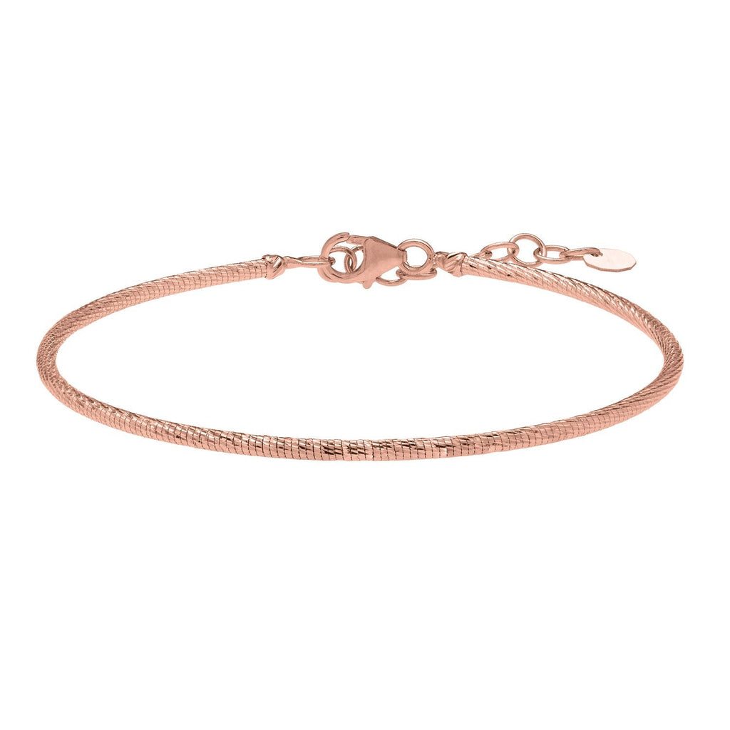 Front view of the 14K rose gold diamond-cut stack bangle
